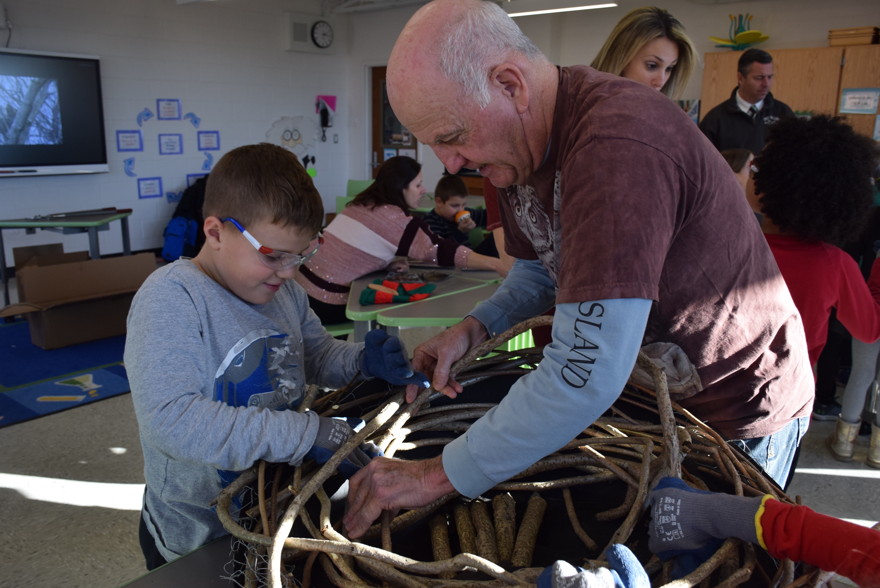 Central Boulevard students construct owl nests in conservation lesson