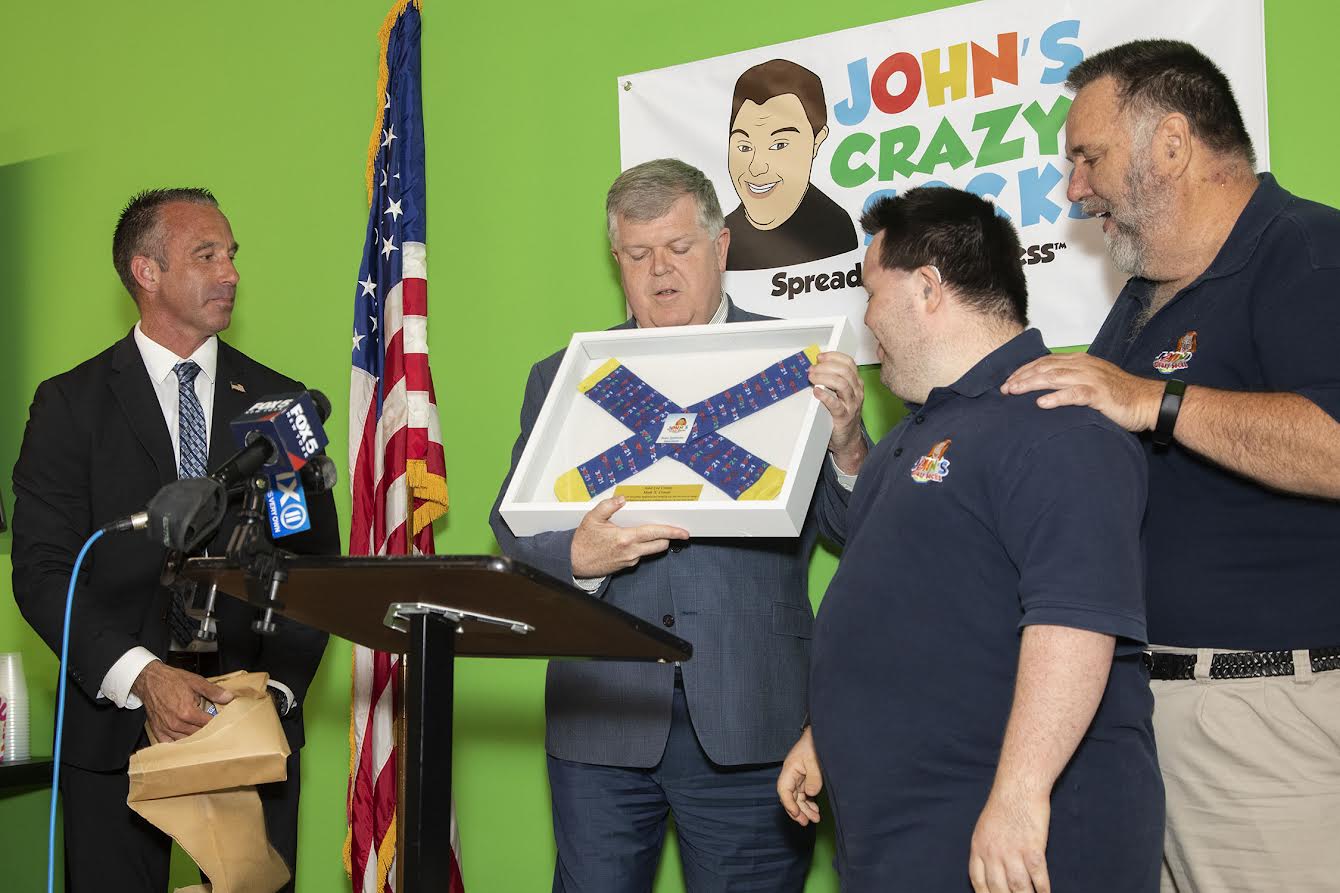 Town Officials Welcome John’s Crazy Socks To East Farmingdale