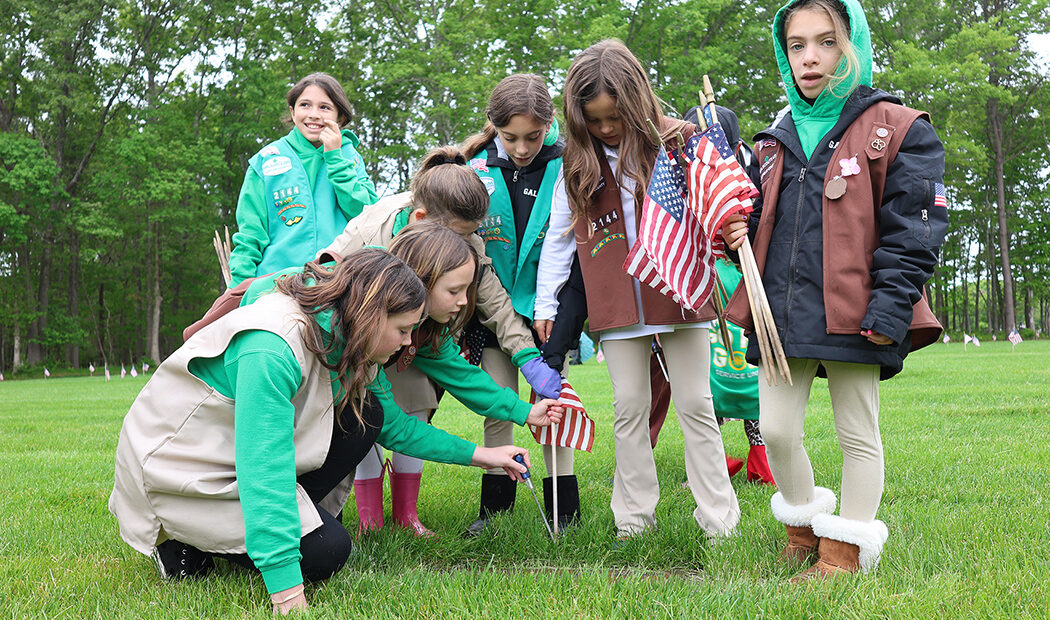 Girl Scouts Of Suffolk County Plant Flags At Veterans&rsquo; Graves At Calverton Cemetery